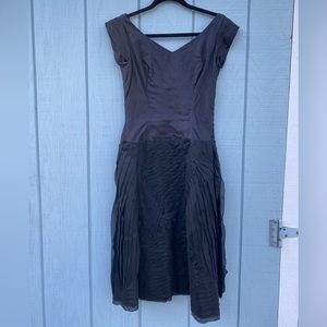 Vintage black off-the-shoulder cocktail dress with textured skirt